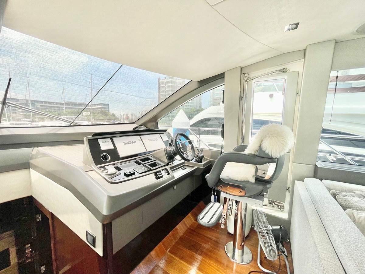a room with a large window and a desk with a large white printer aboard EXCELLENCE Yacht for Sale