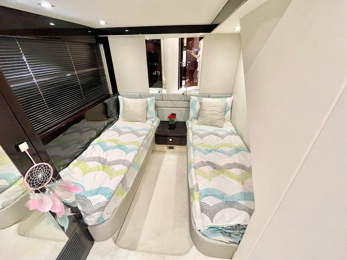 a room with a bed and a mirror aboard EXCELLENCE Yacht for Sale