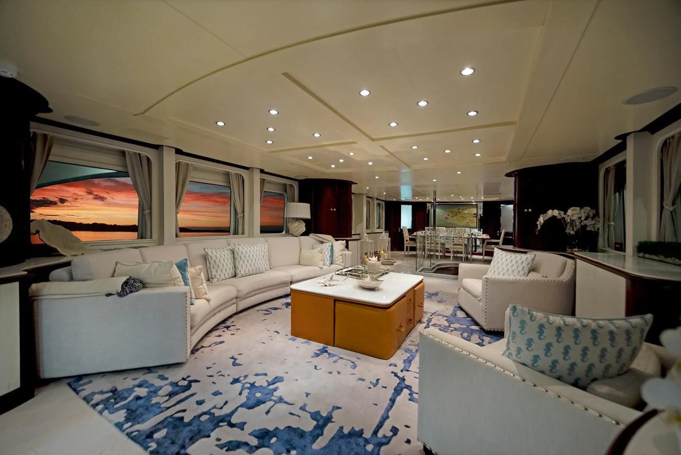 a living room with white couches aboard GITANA Yacht for Sale