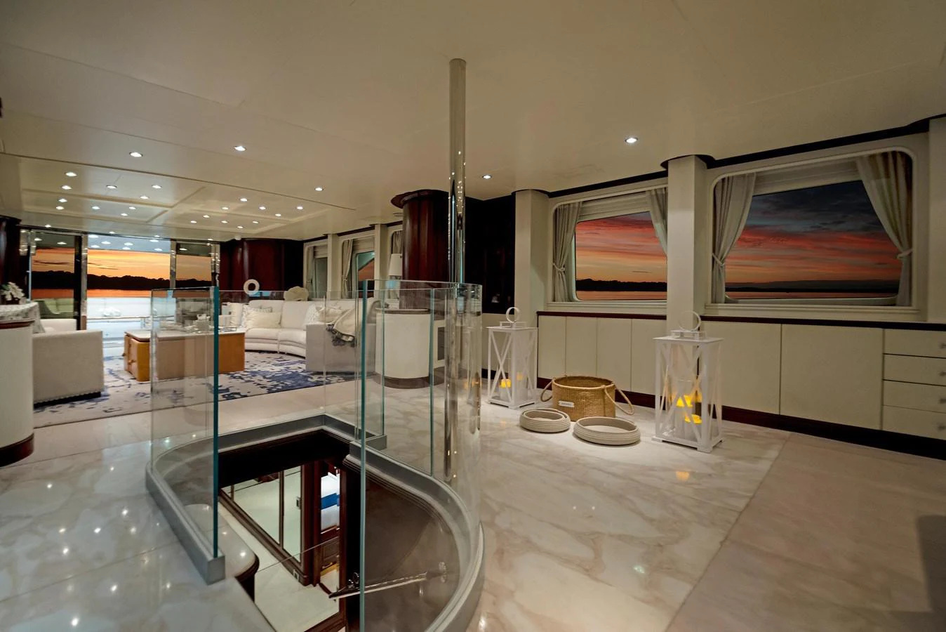a large white room with a large mirror and a large white table aboard GITANA Yacht for Sale