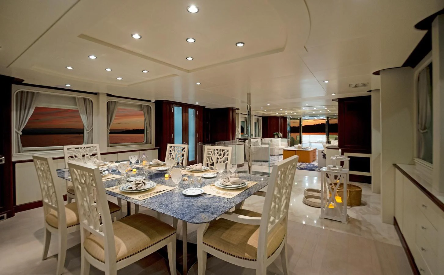 a dining room with white chairs aboard GITANA Yacht for Sale