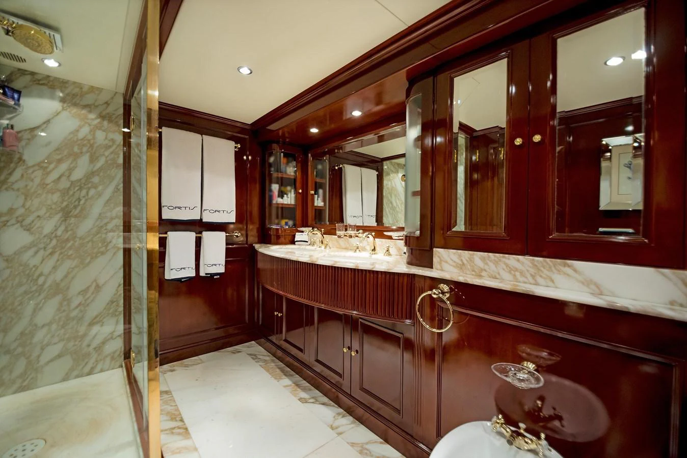 a bathroom with a large mirror aboard GITANA Yacht for Sale