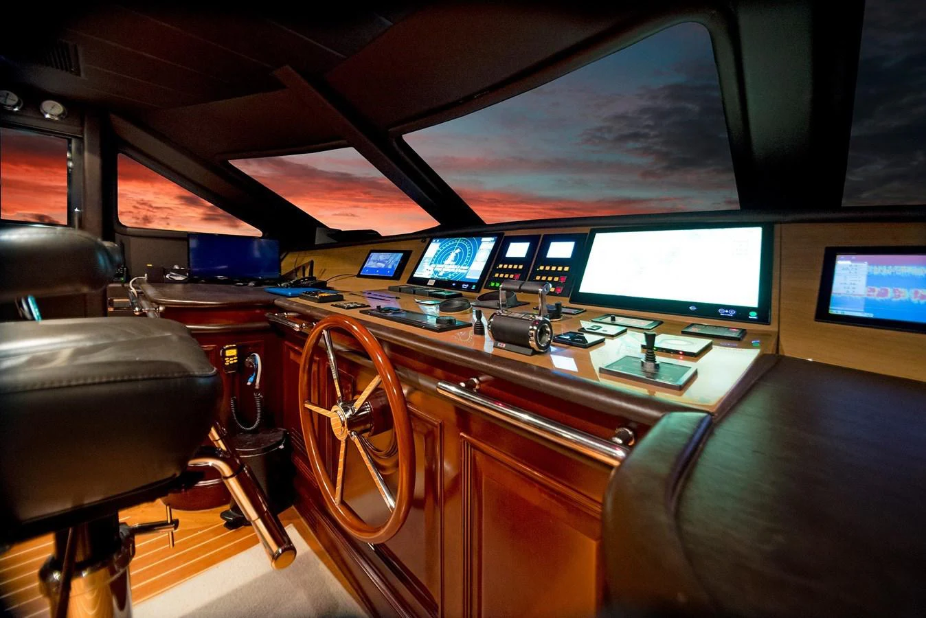 a control room with a large screen aboard GITANA Yacht for Sale