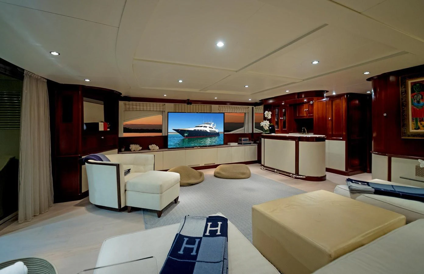 a room with a large screen aboard GITANA Yacht for Sale