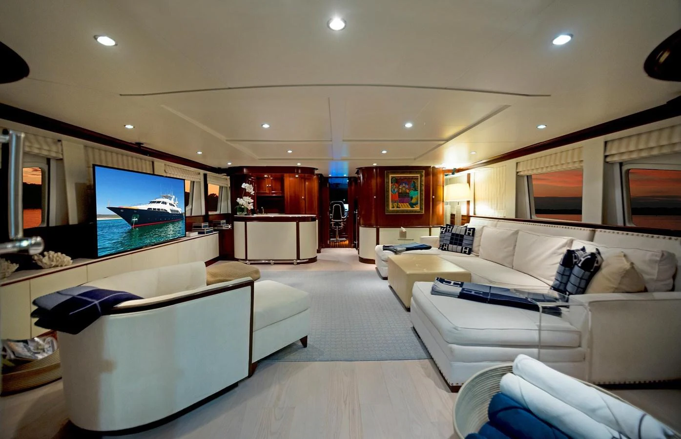 a room with couches and a tv aboard GITANA Yacht for Sale