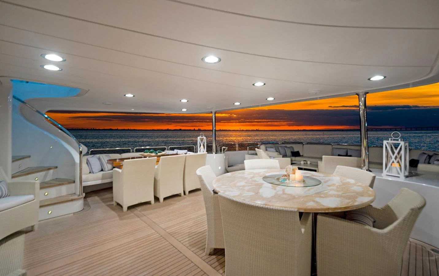 a large room with a table and chairs aboard GITANA Yacht for Sale