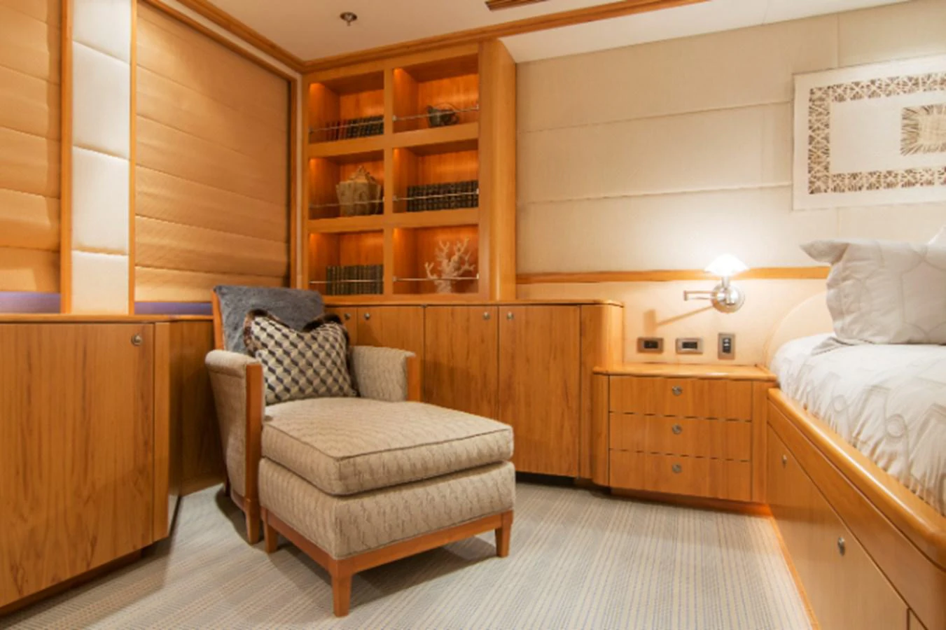 a room with a bed and a chair aboard 4*PUPPIES Yacht for Sale