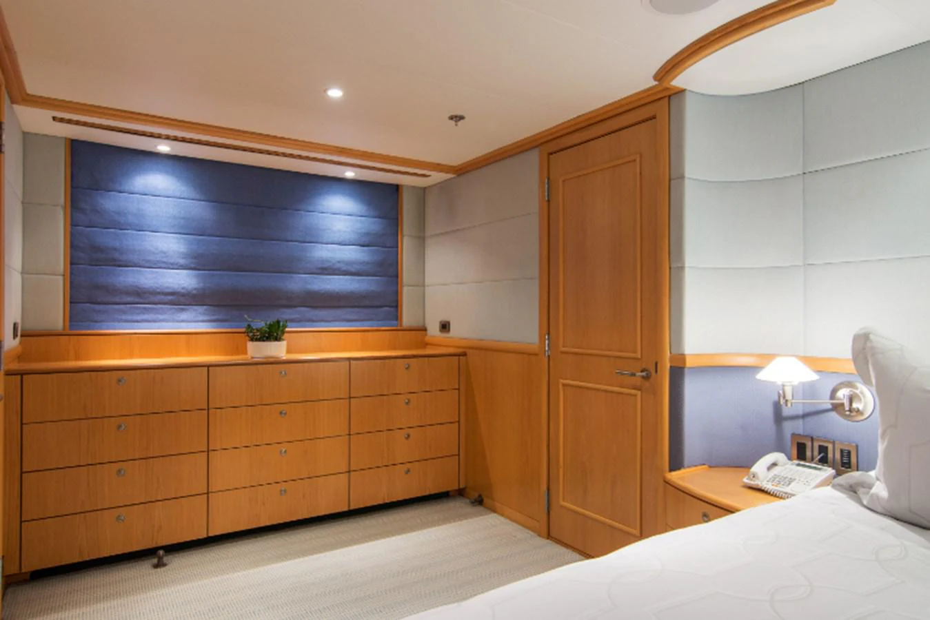 a room with a bed and a closet aboard 4*PUPPIES Yacht for Sale