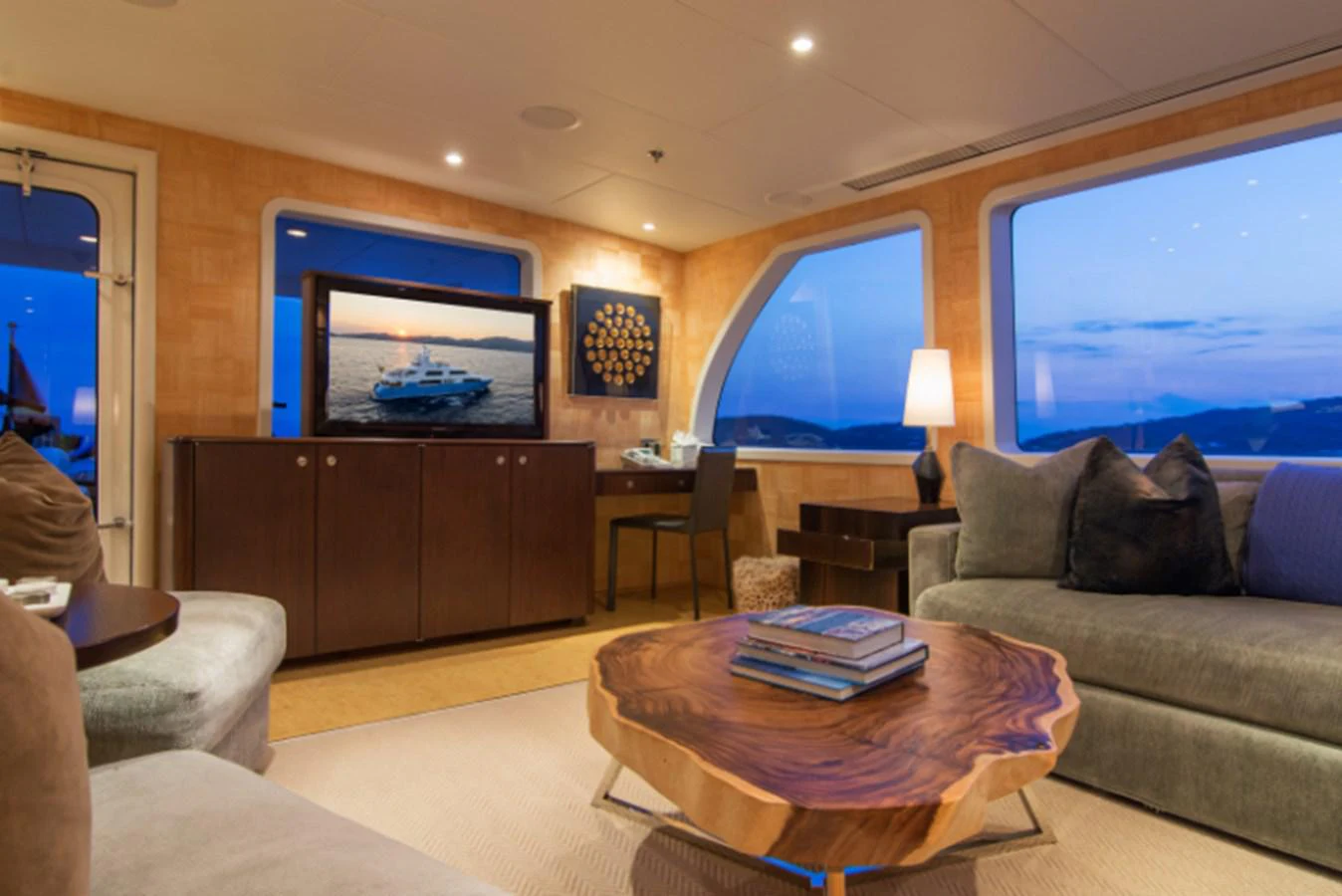 a living room with a large television aboard 4*PUPPIES Yacht for Sale