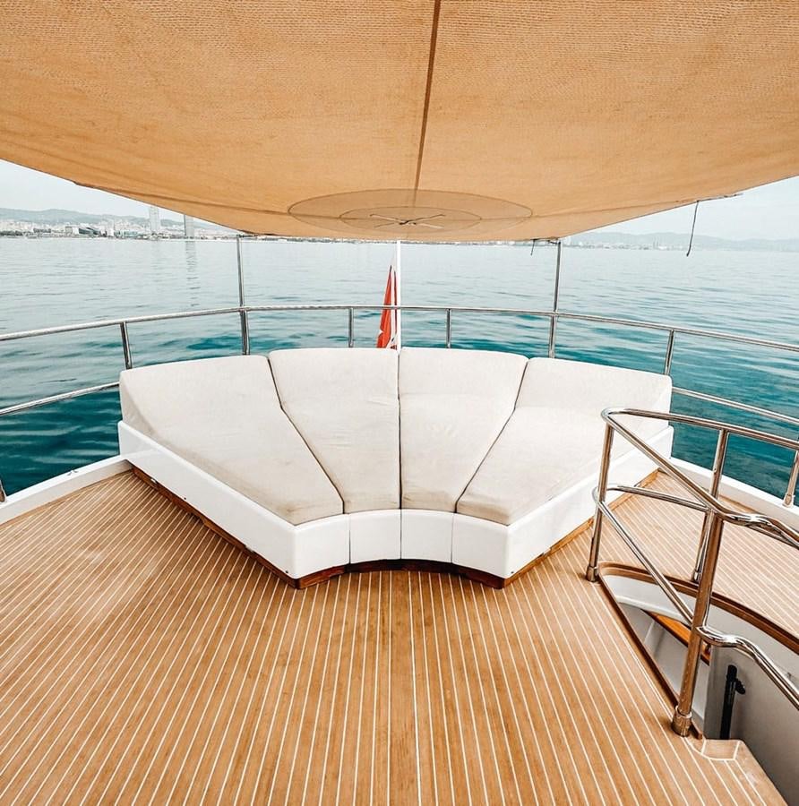 a bed on a deck aboard LAZIZA Yacht for Sale