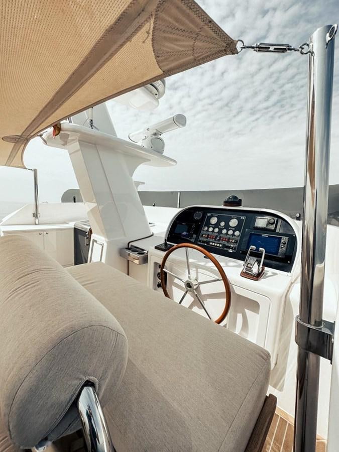 a small white tent with a small radio and a bed aboard LAZIZA Yacht for Sale