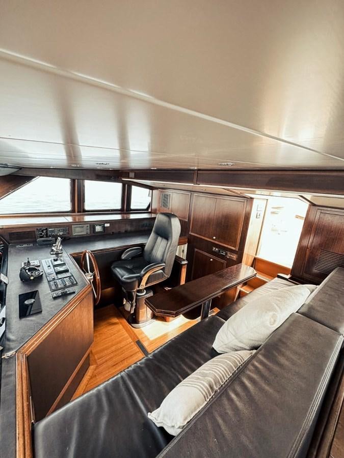 a living room with a couch and a table aboard LAZIZA Yacht for Sale