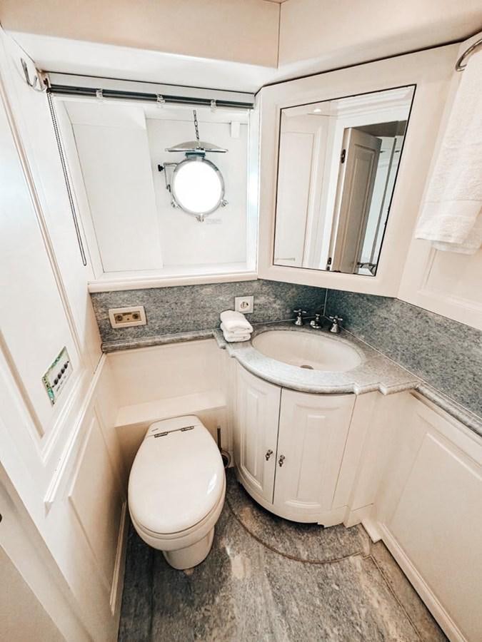 a bathroom with a sink and toilet aboard LAZIZA Yacht for Sale
