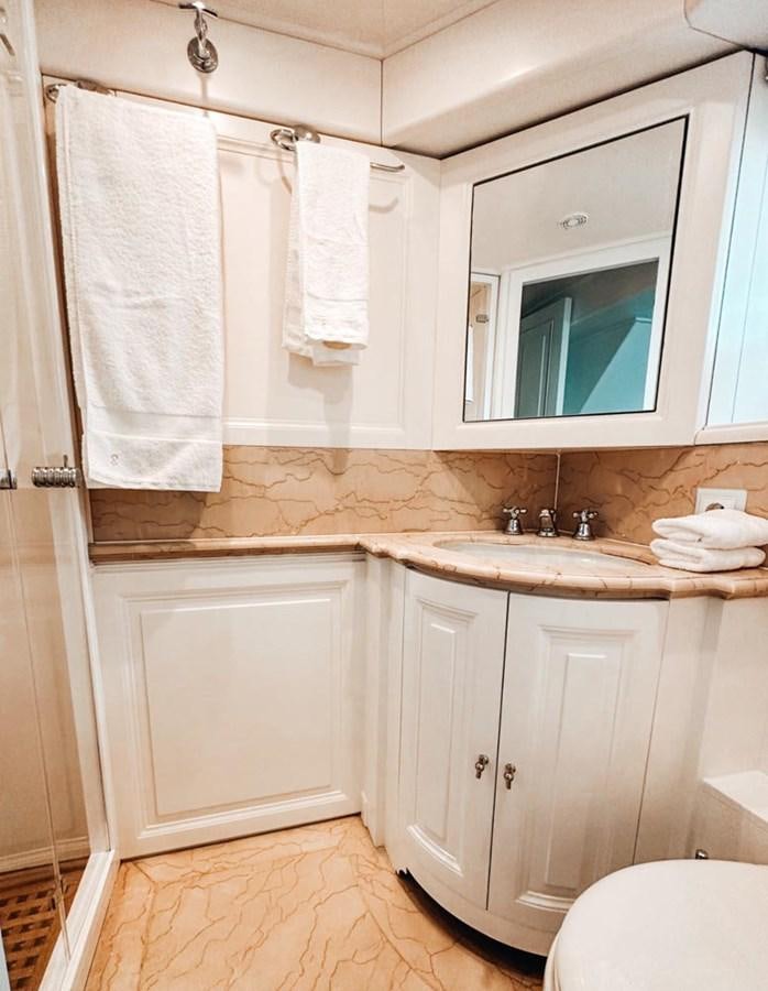 a bathroom with white towels aboard LAZIZA Yacht for Sale