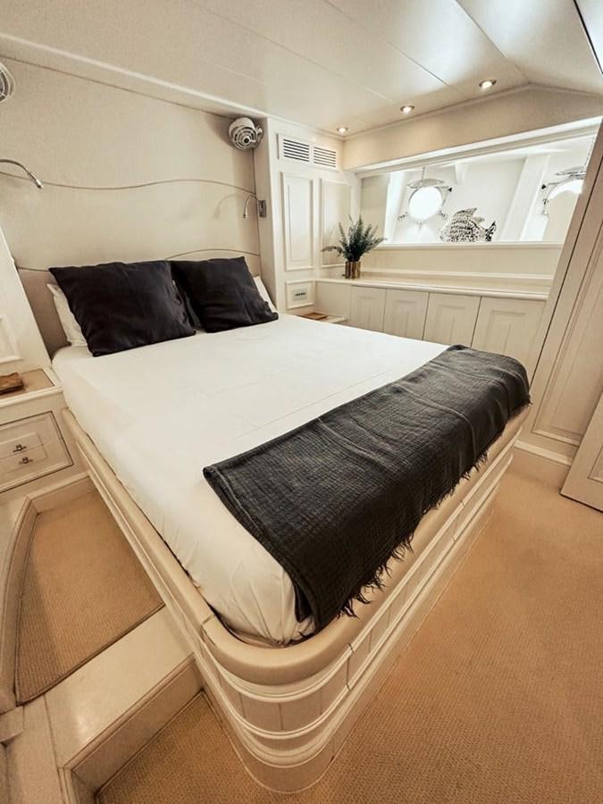 a bed in a room aboard LAZIZA Yacht for Sale
