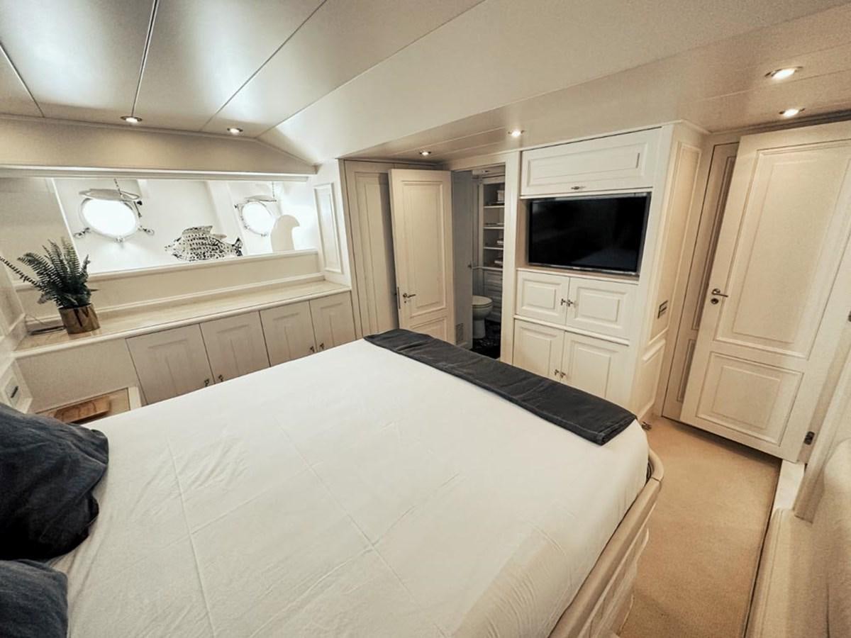 a bedroom with a large bed aboard LAZIZA Yacht for Sale