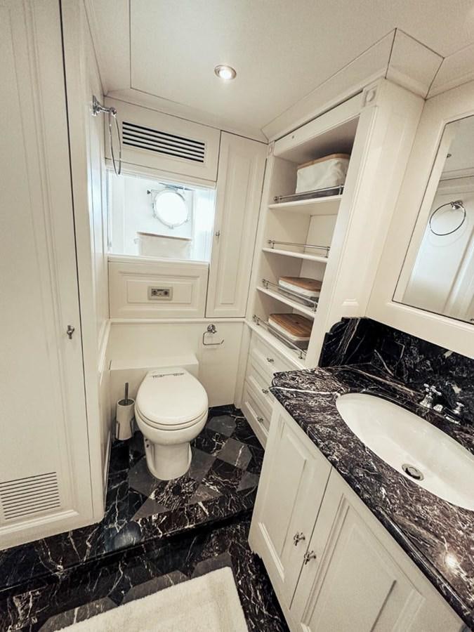 a small bathroom with a toilet and sink aboard LAZIZA Yacht for Sale