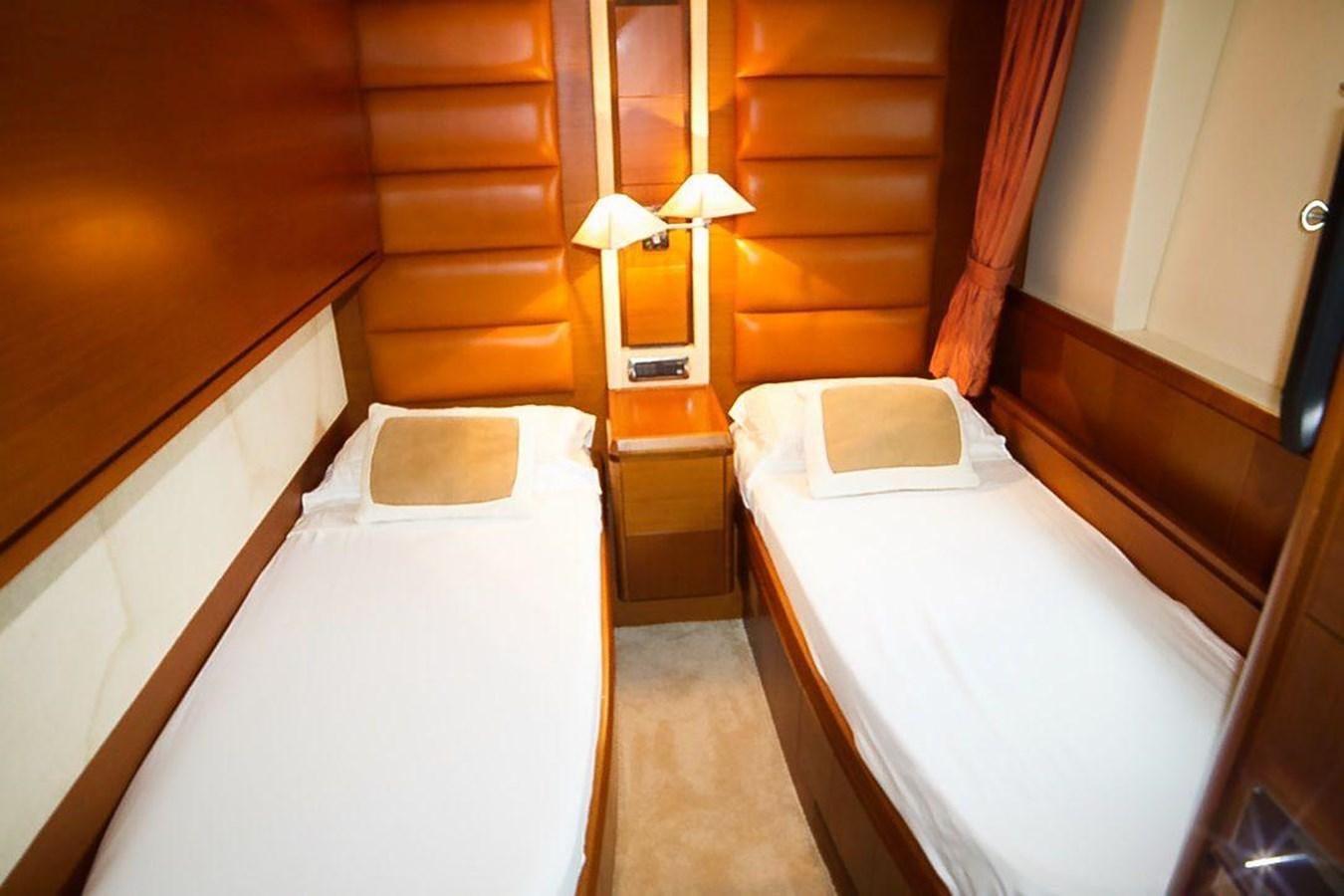 a room with two beds aboard AZIMUT 116/32 Yacht for Sale