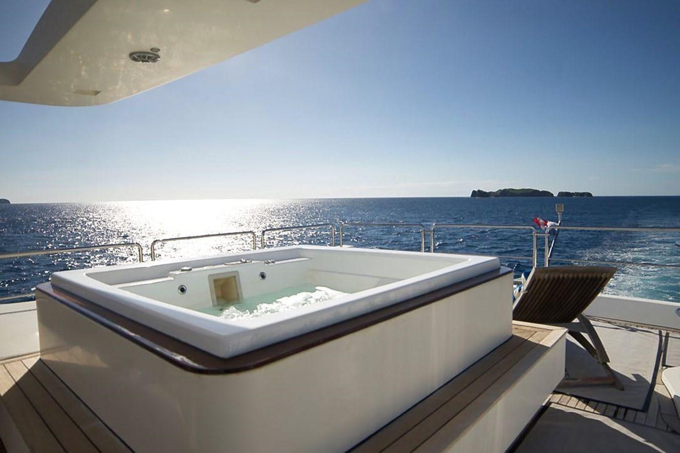 a white boat on a beach aboard AZIMUT 116/32 Yacht for Sale