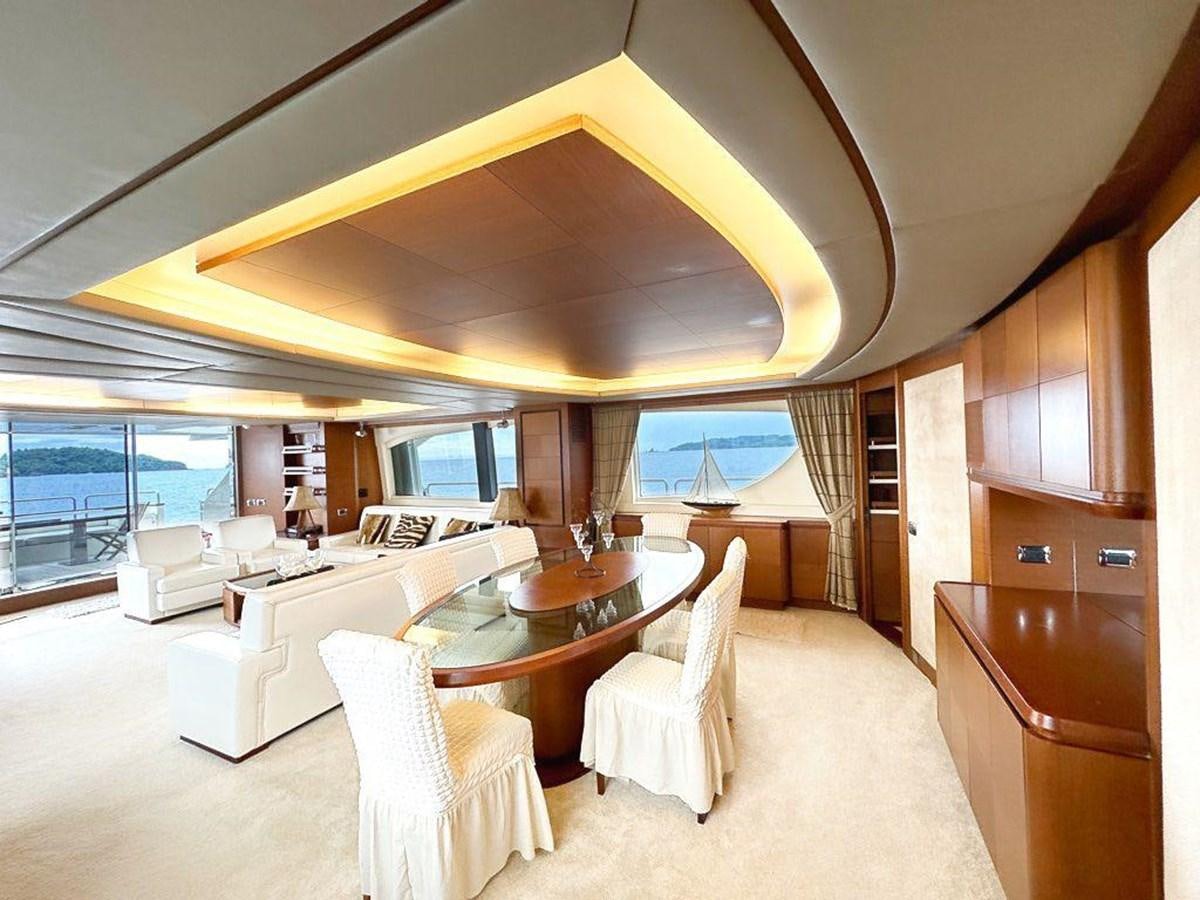 a large living room with a large window aboard AZIMUT 116/32 Yacht for Sale