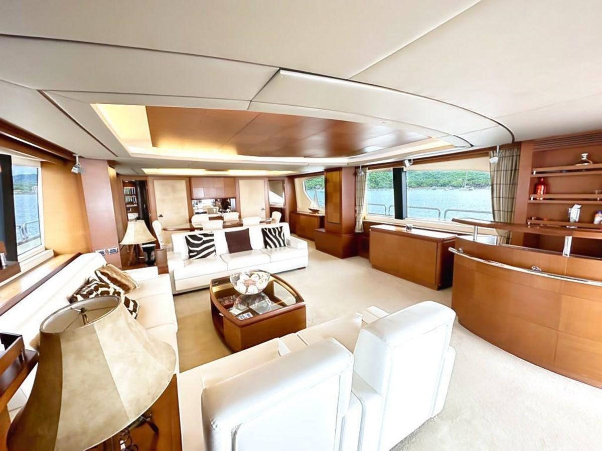 a room with a bed and a table aboard AZIMUT 116/32 Yacht for Sale