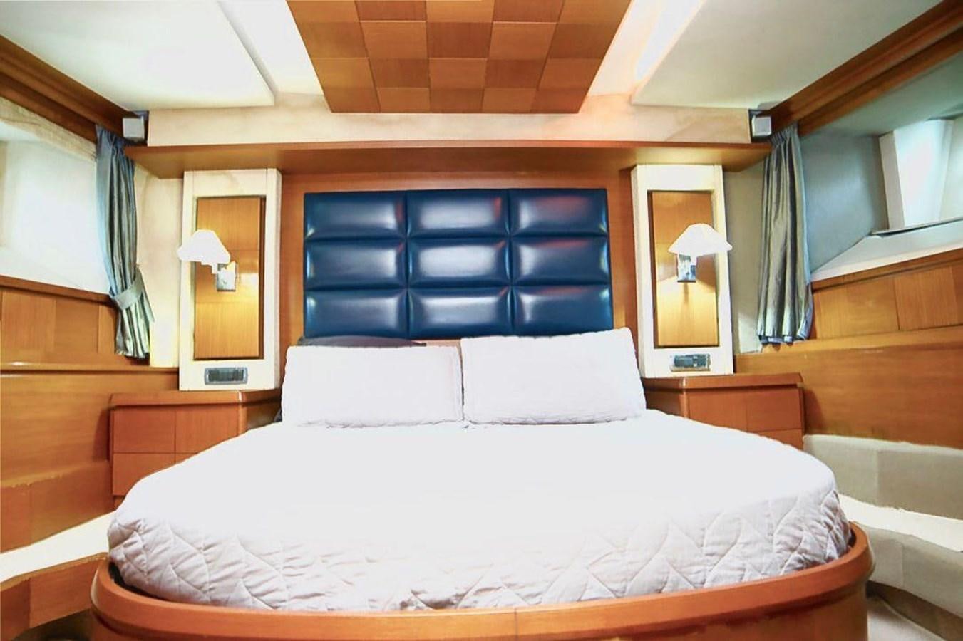 a bed with white sheets aboard AZIMUT 116/32 Yacht for Sale