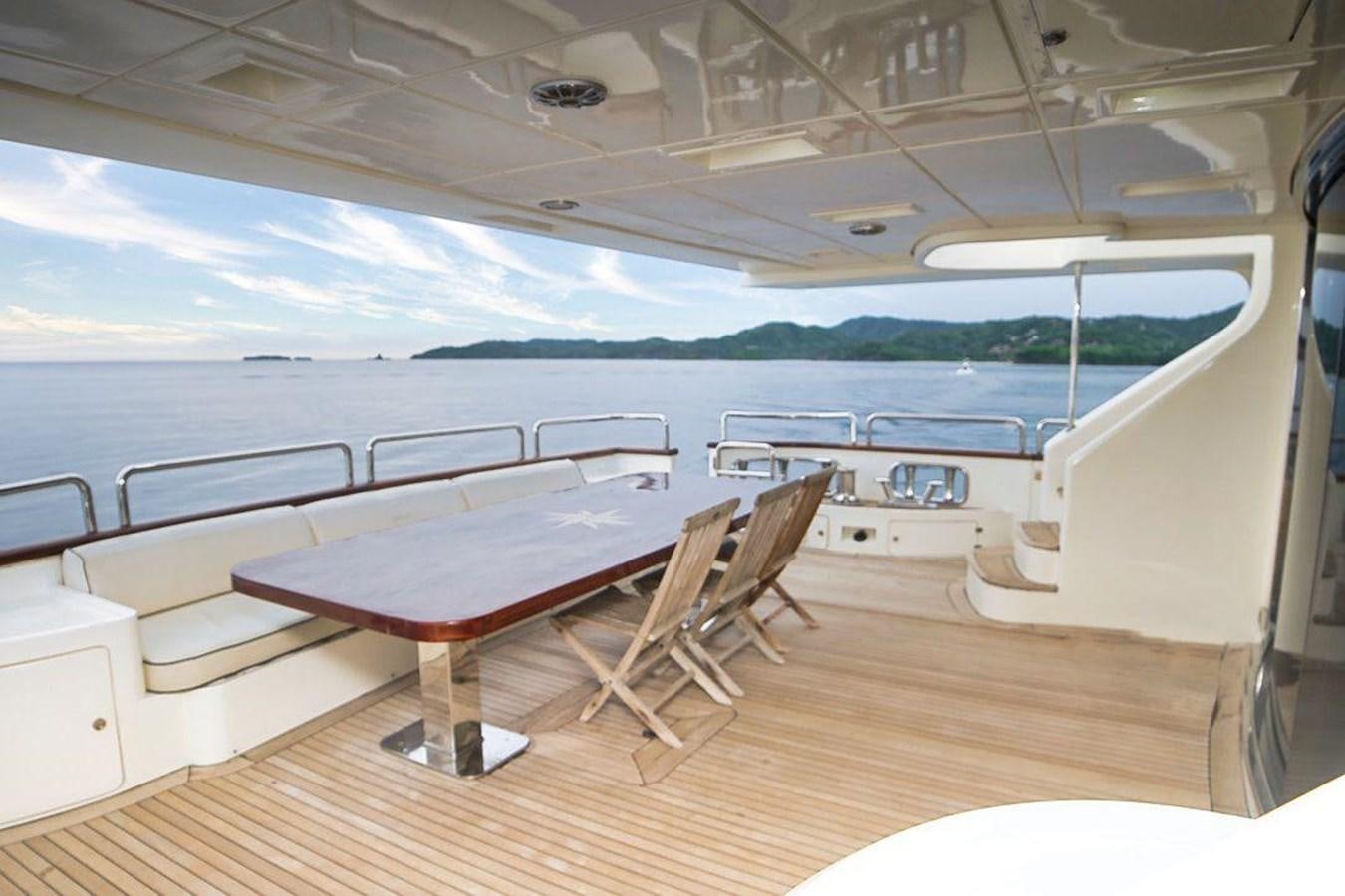 a room with a table and chairs aboard AZIMUT 116/32 Yacht for Sale