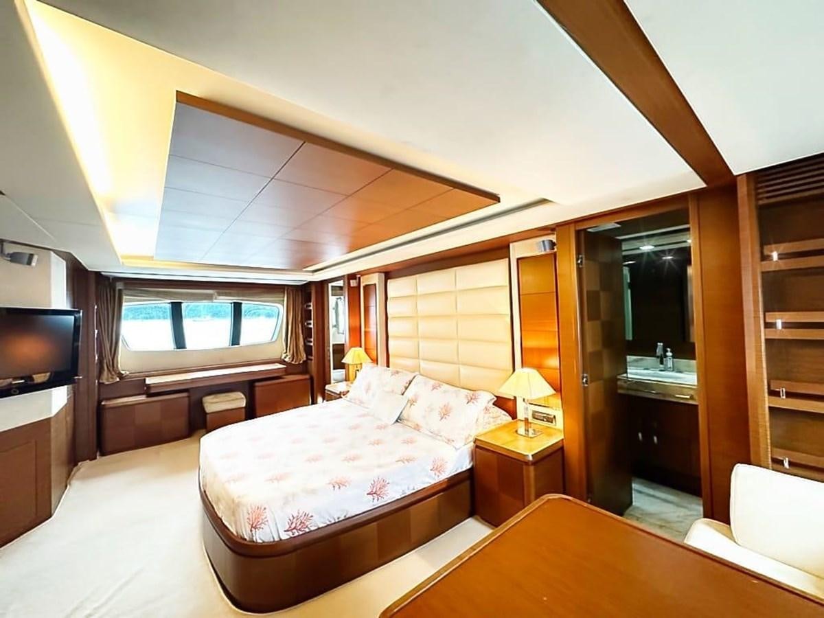 a bedroom with a bed and a tv aboard AZIMUT 116/32 Yacht for Sale