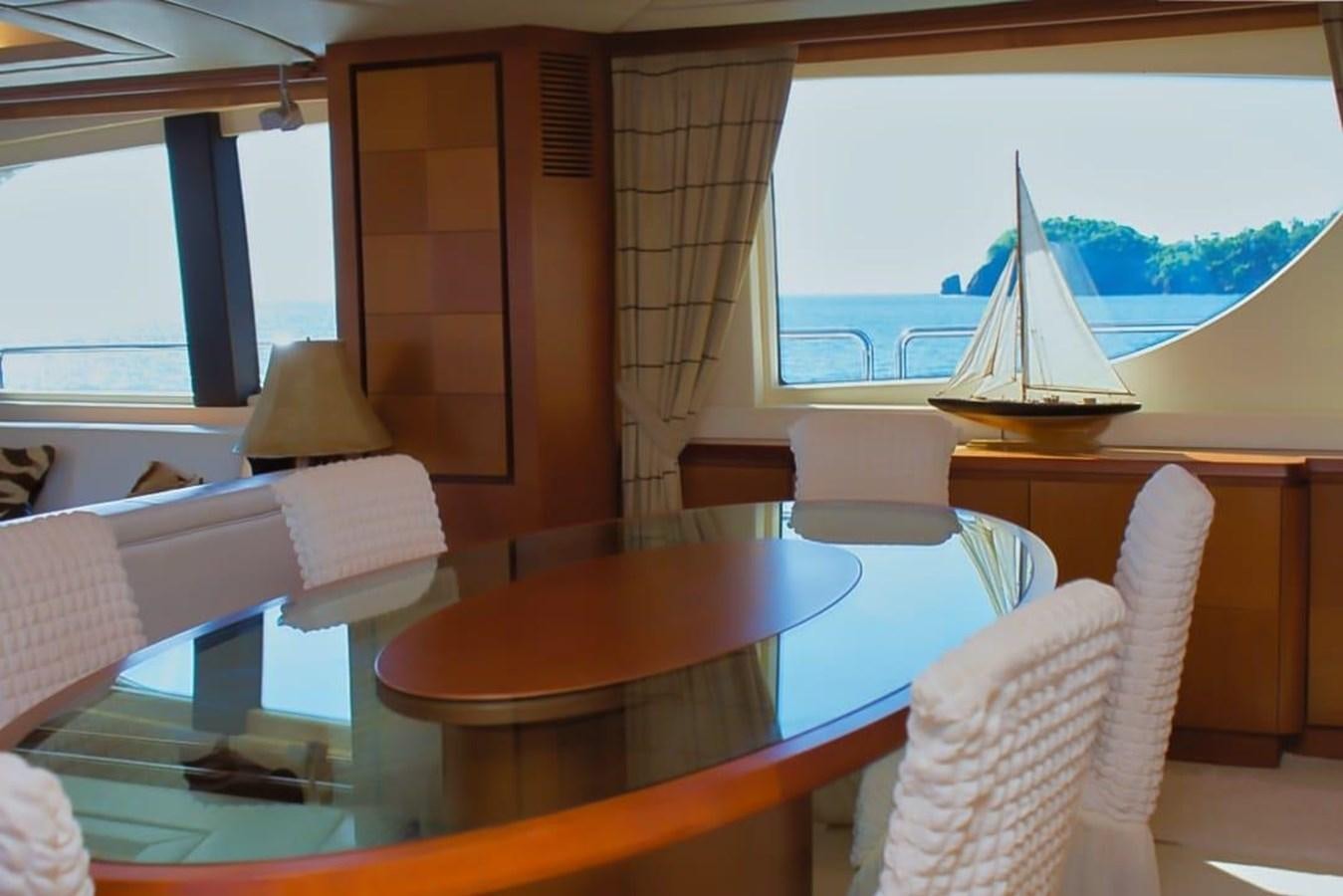 a room with a table and chairs aboard AZIMUT 116/32 Yacht for Sale