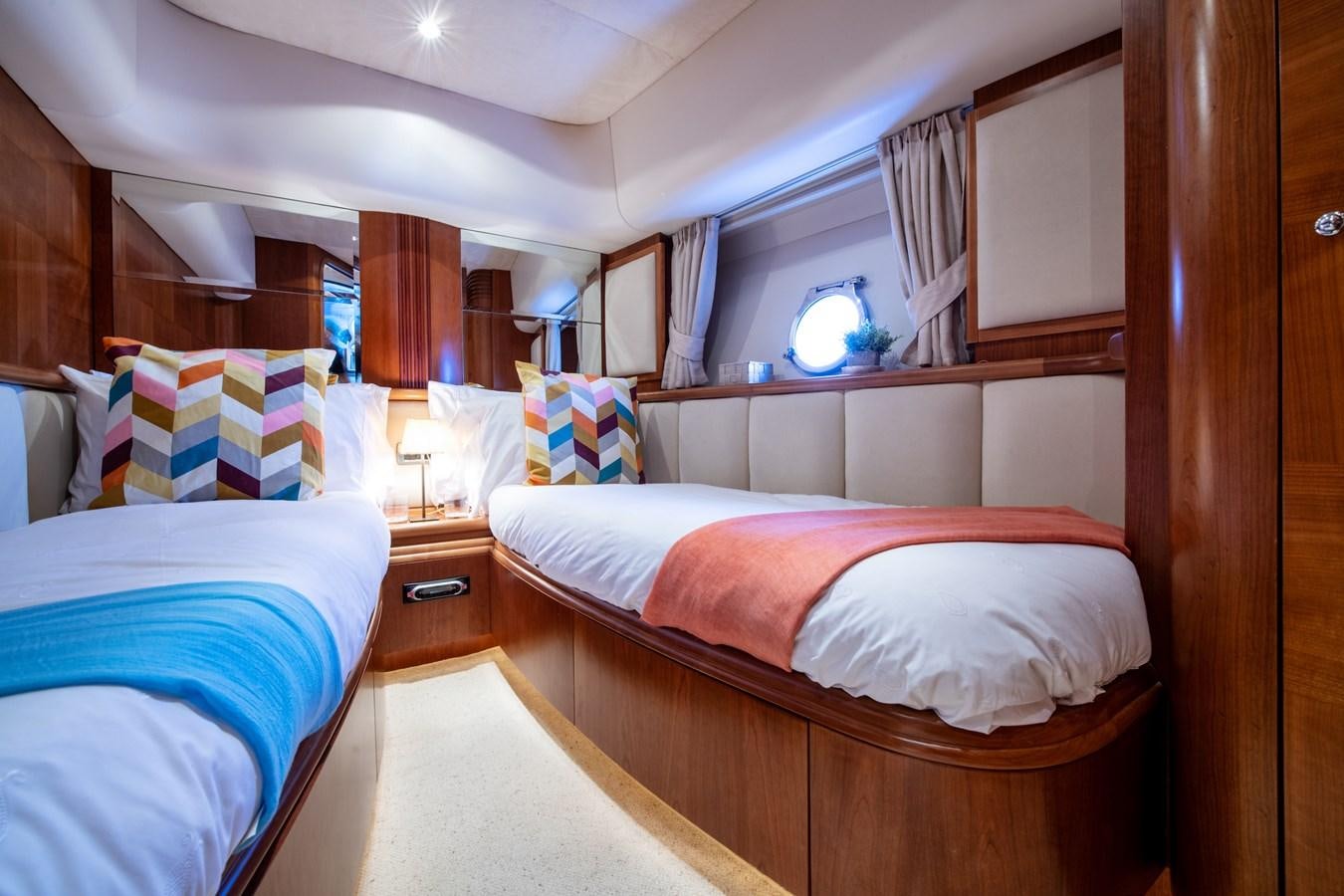 a couple of beds in a room aboard TIME OUT OF LONDON Yacht for Sale