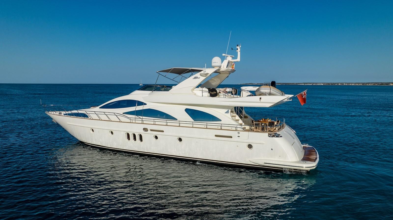 a white yacht on the water aboard TIME OUT OF LONDON Yacht for Sale