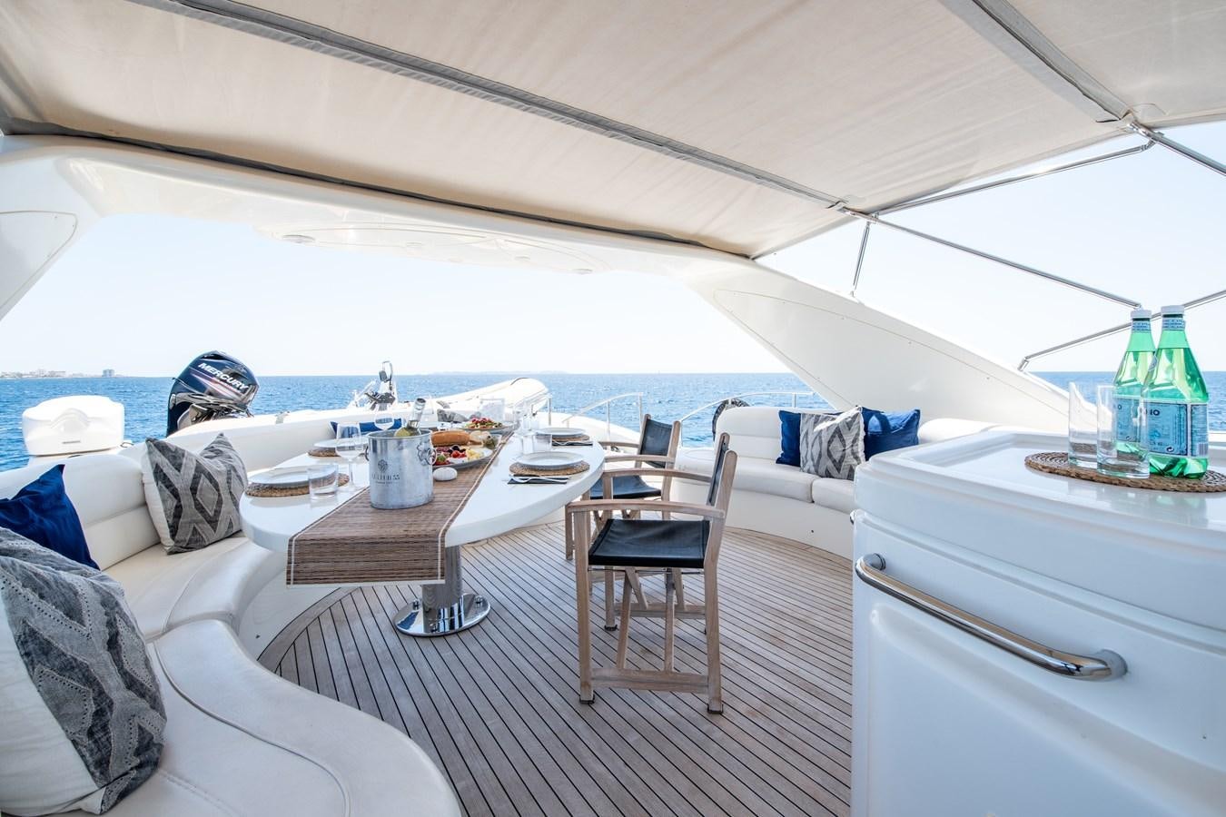 a tent with a table and chairs aboard TIME OUT OF LONDON Yacht for Sale