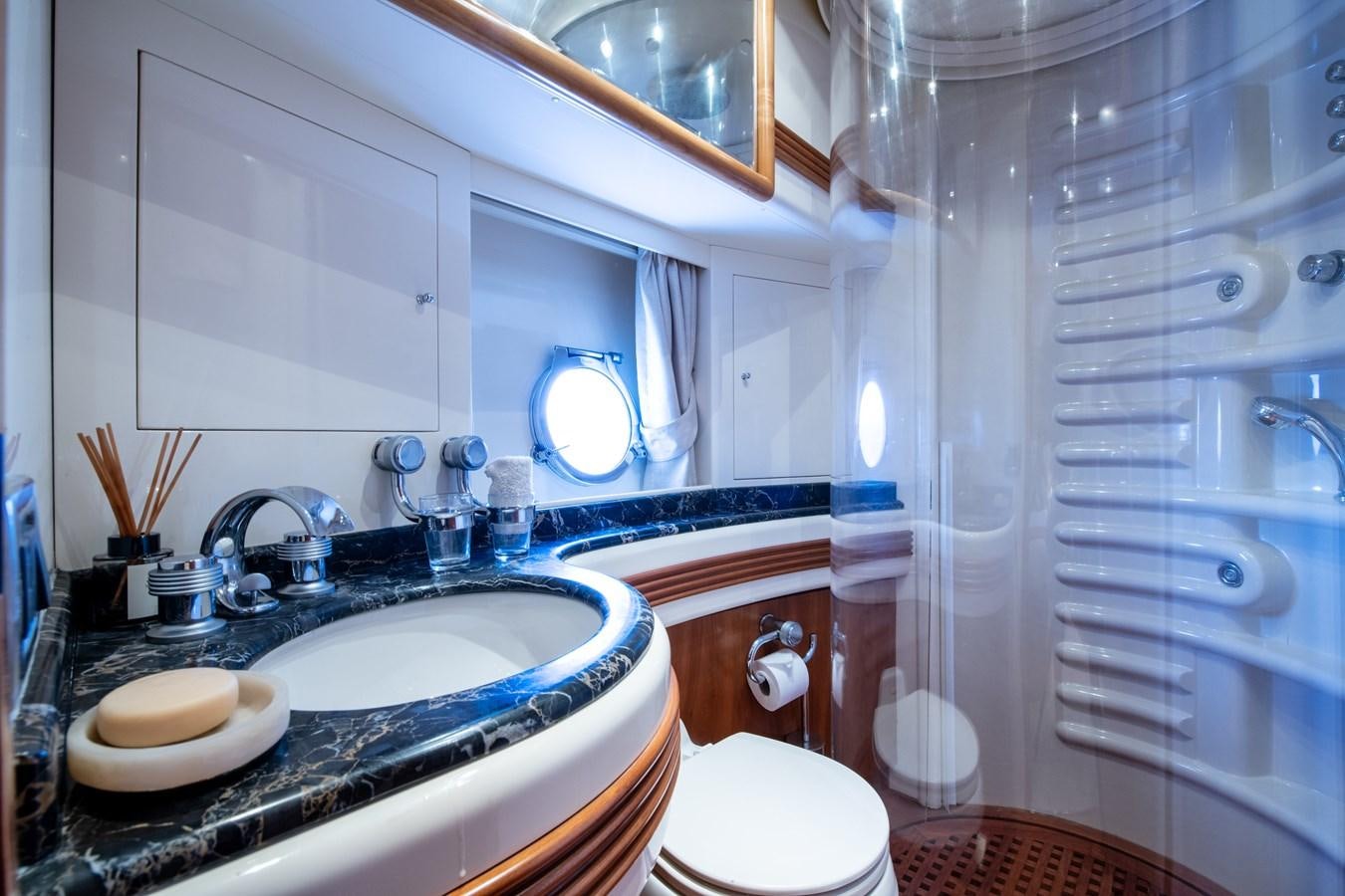 a bathroom with a sink and a shower aboard TIME OUT OF LONDON Yacht for Sale