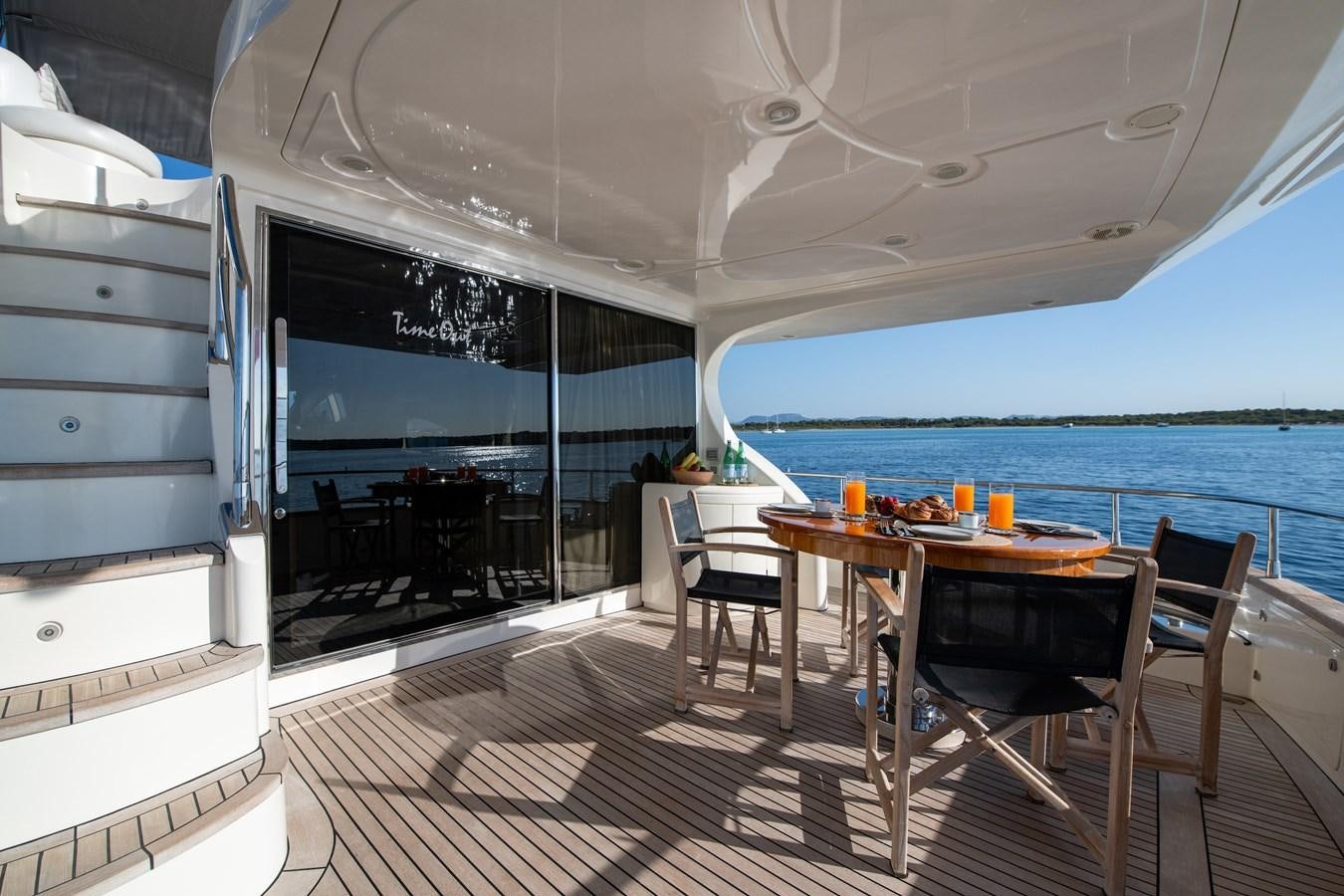 a room with a table and chairs aboard TIME OUT OF LONDON Yacht for Sale