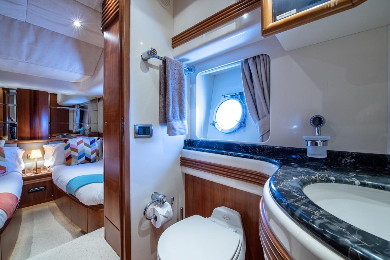 a bathroom with a sink and a toilet aboard TIME OUT OF LONDON Yacht for Sale