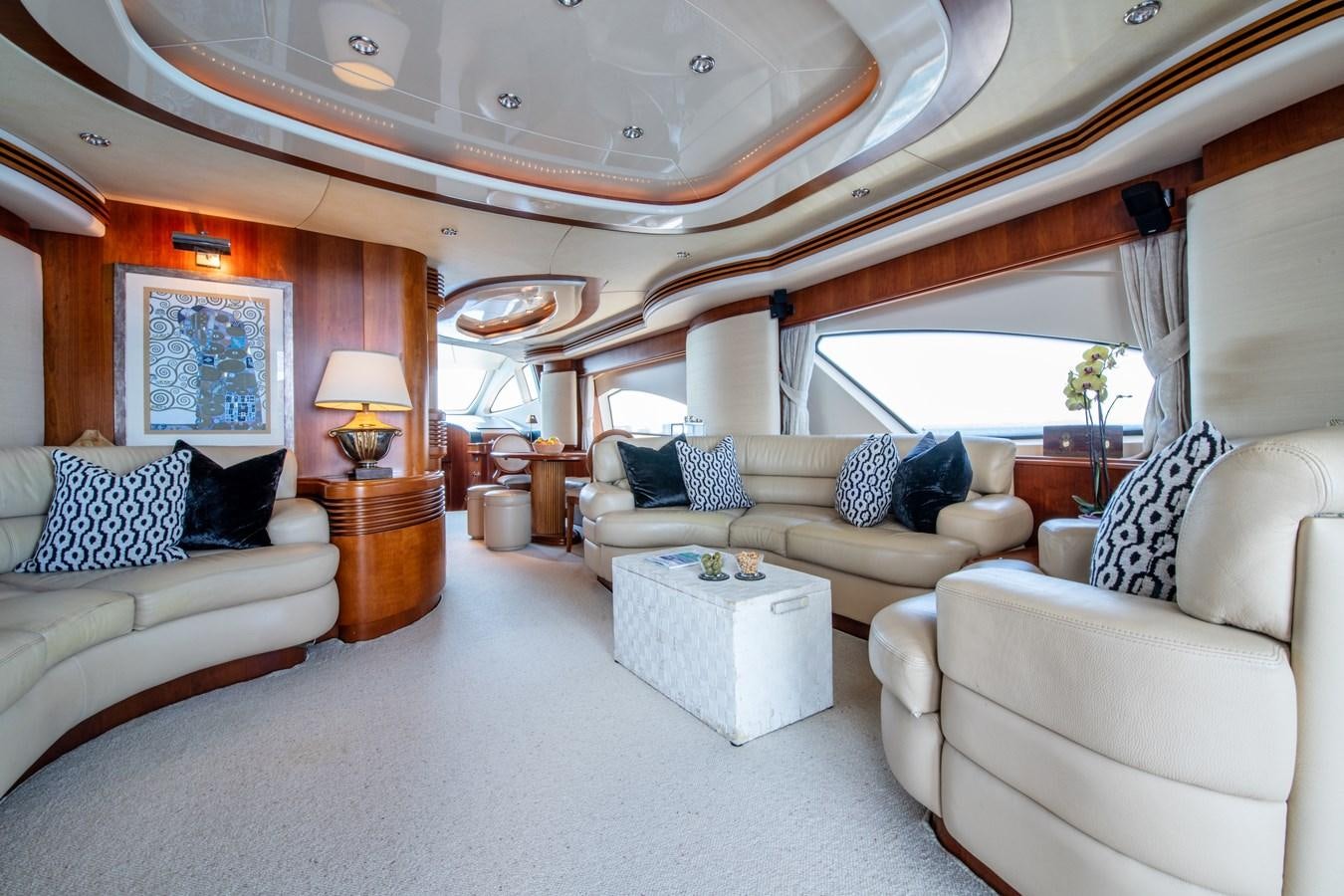 a large living room with a large chandelier aboard TIME OUT OF LONDON Yacht for Sale