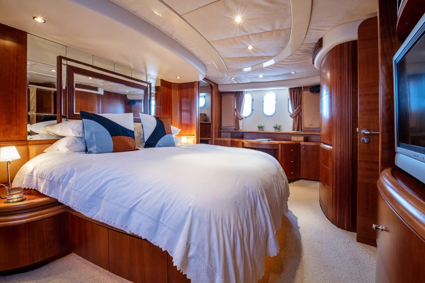 a bed in a room aboard TIME OUT OF LONDON Yacht for Sale