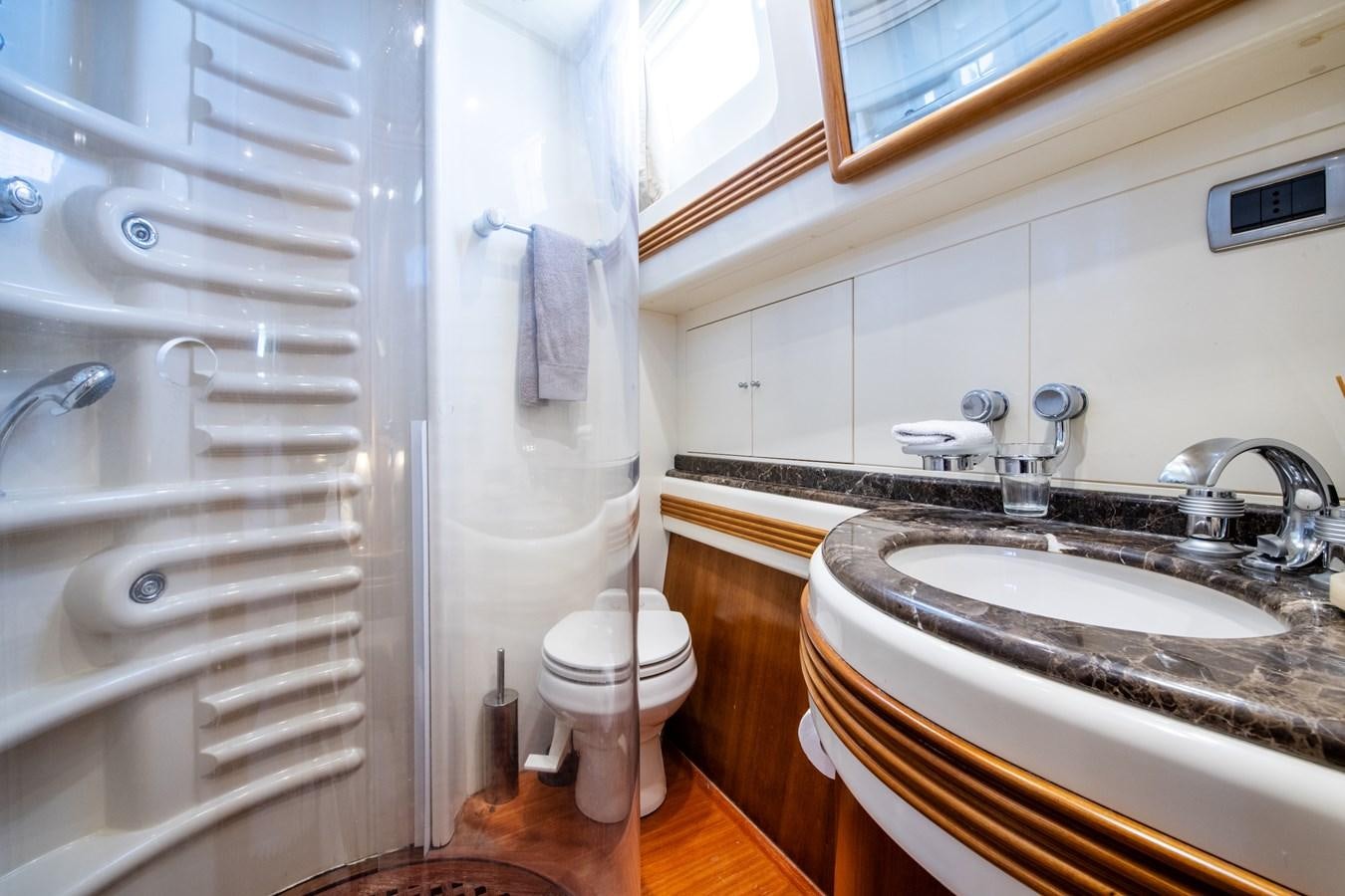 a bathroom with a sink and a toilet aboard TIME OUT OF LONDON Yacht for Sale