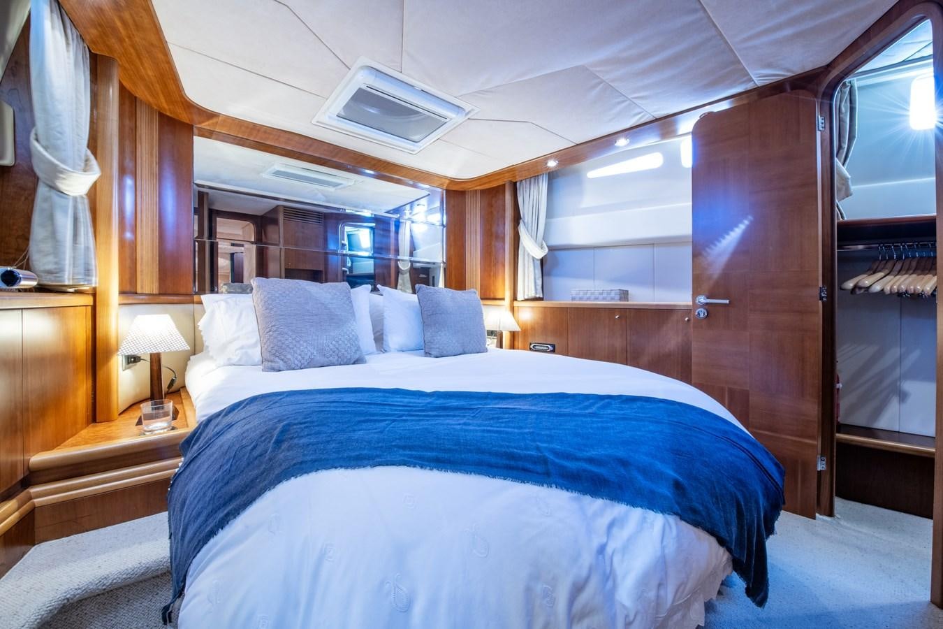 a bed with a white sheet aboard TIME OUT OF LONDON Yacht for Sale