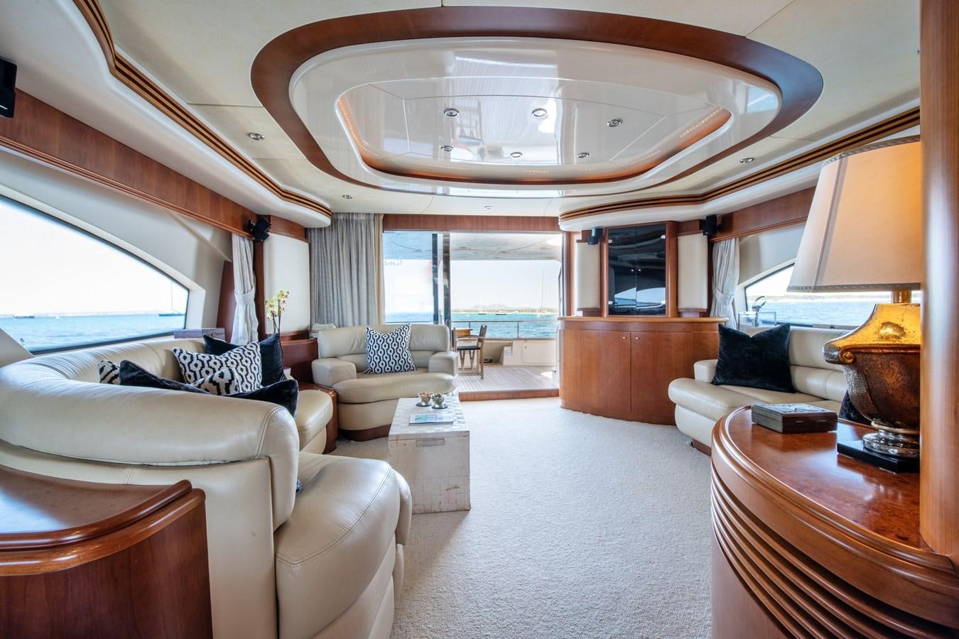 a large living room with a large white chandelier aboard TIME OUT OF LONDON Yacht for Sale