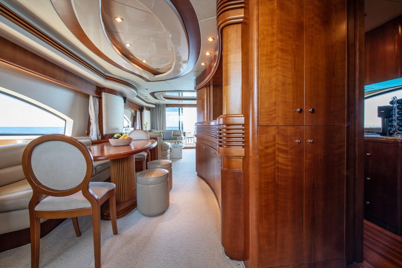 a room with a table and chairs aboard TIME OUT OF LONDON Yacht for Sale