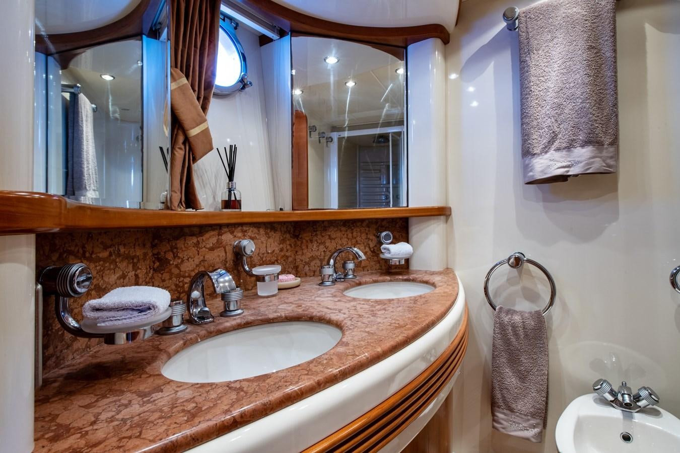 a bathroom with a large mirror aboard TIME OUT OF LONDON Yacht for Sale
