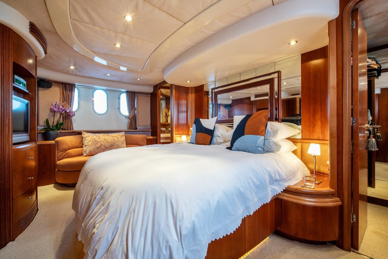 a large bed in a hotel room aboard TIME OUT OF LONDON Yacht for Sale