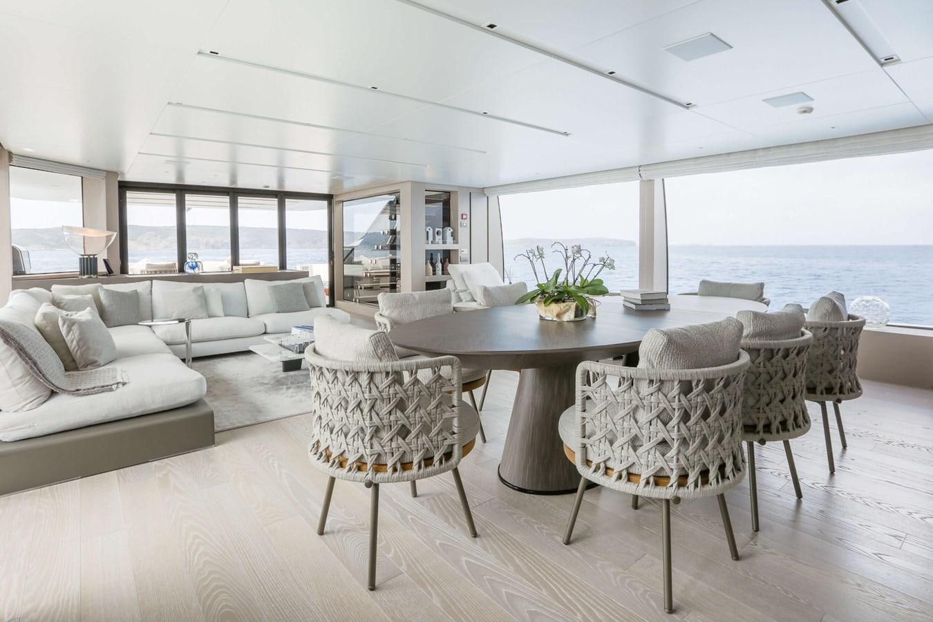 a room with a table and chairs aboard 2022 SANLORENZO SL120A Yacht for Sale
