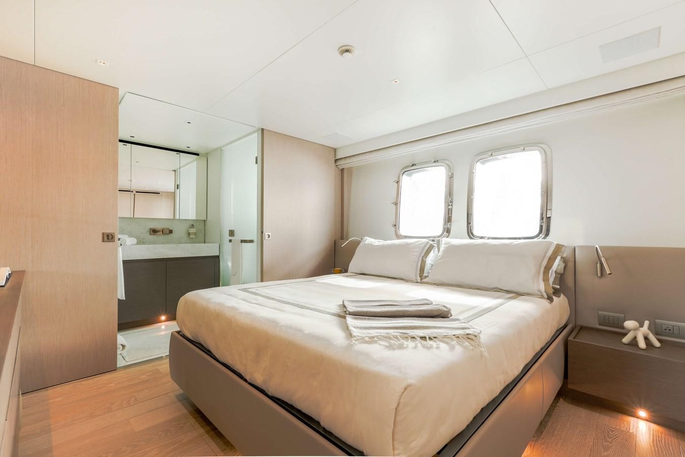a room with a bed and a window aboard 2022 SANLORENZO SL120A Yacht for Sale