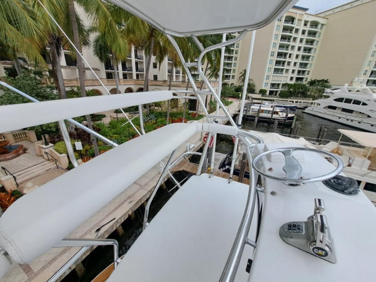 a boat docked at a pier aboard CLAIRE TOO Yacht for Sale