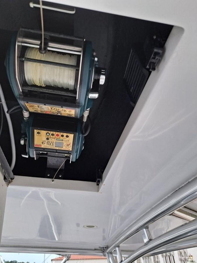 a black and yellow vehicle aboard CLAIRE TOO Yacht for Sale