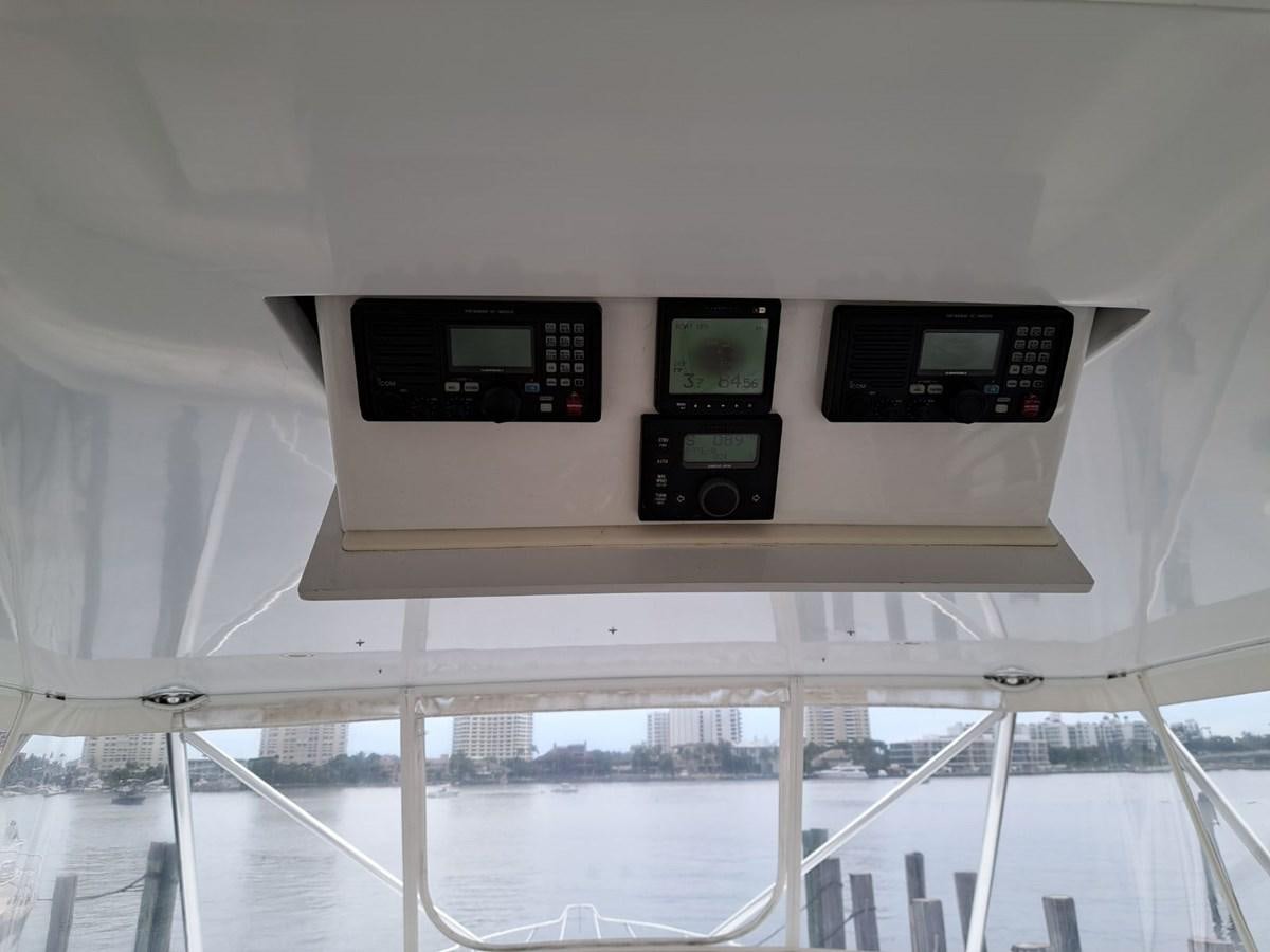a row of screens on a white wall aboard CLAIRE TOO Yacht for Sale