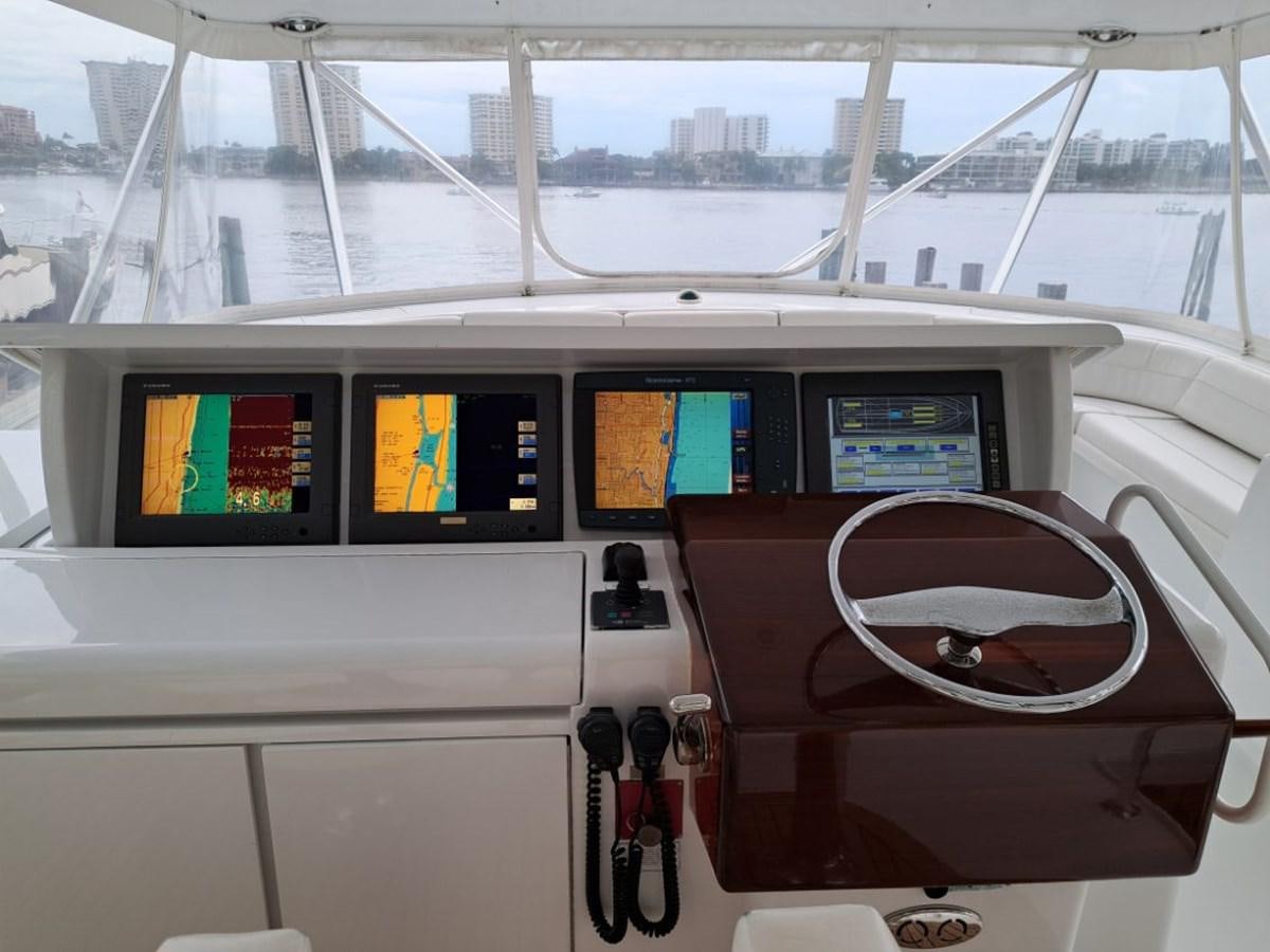 a boat with a screen and a seat aboard CLAIRE TOO Yacht for Sale