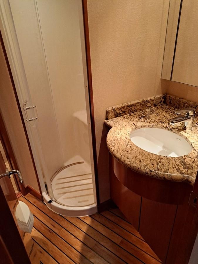 a bathroom with a sink and a toilet aboard CLAIRE TOO Yacht for Sale